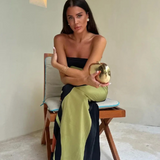 "Paula - Elegantna obleka z izrezom" can be rewritten as "Paula - Šik obleka z izrezom".